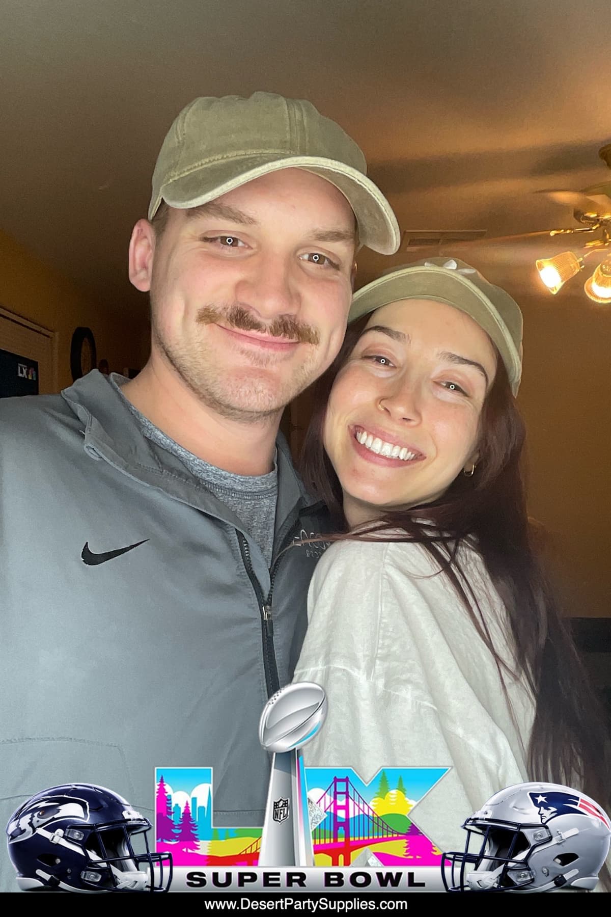 Two guests smiling together for a photo booth picture